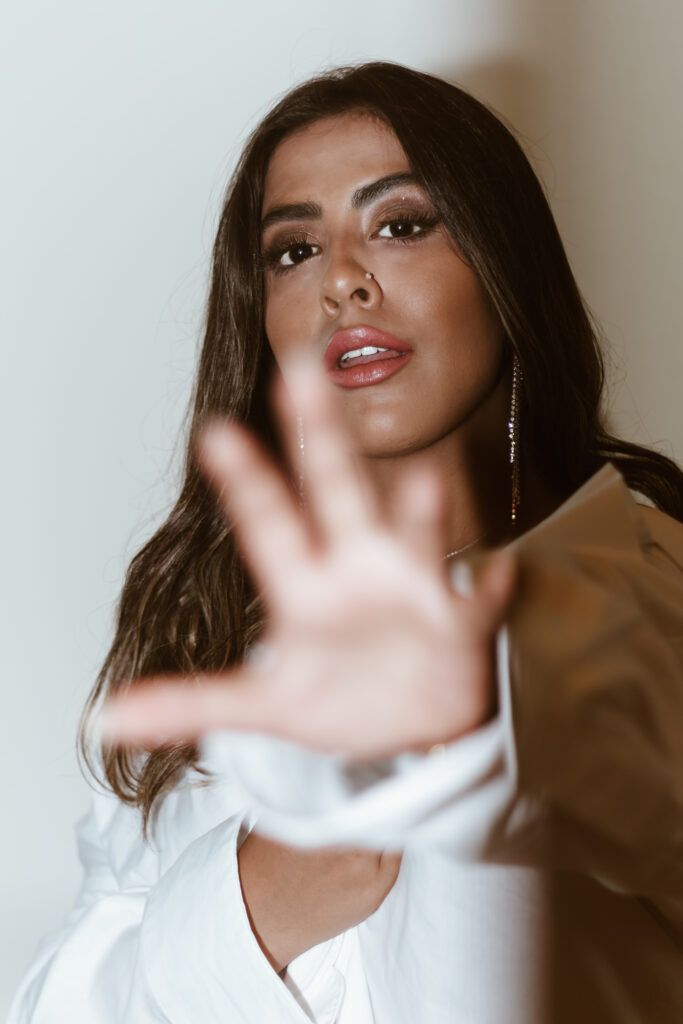 Marzia pointing her hand forward.